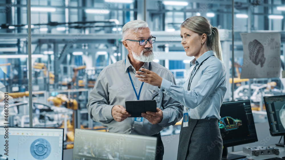 Poster car factory: female project manager talks to male automotive engineer, plan strategy using tablet co
