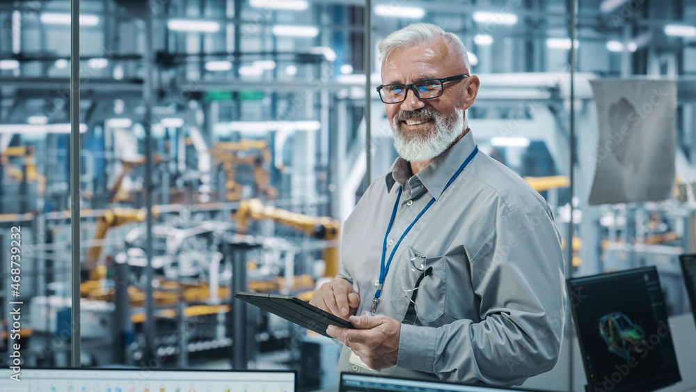 Aufkleber car factory office: portrait of senior white male chief engineer using tablet computer in automated 