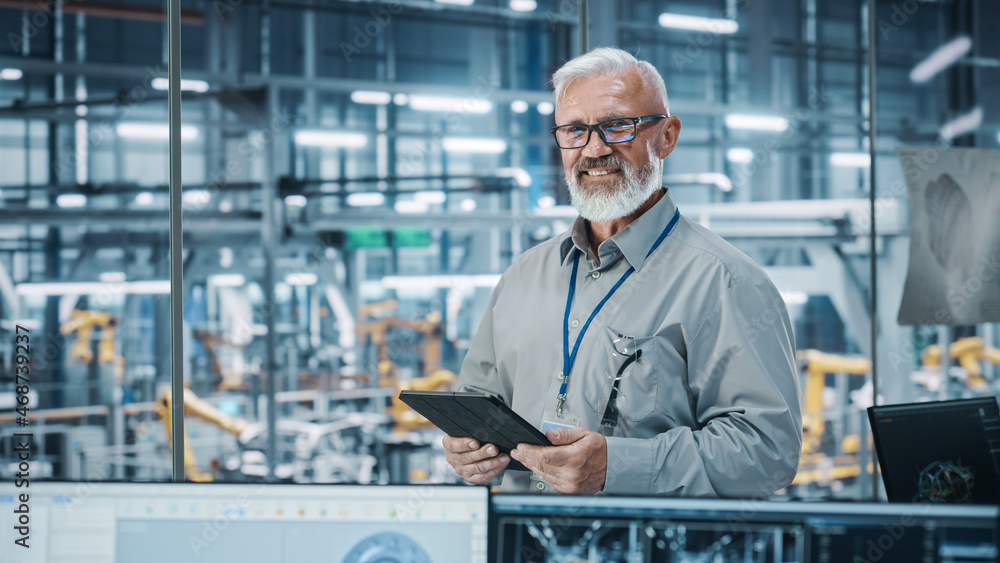 Leinwandbilder car factory office: portrait of senior white male chief engineer using tablet computer in automated 