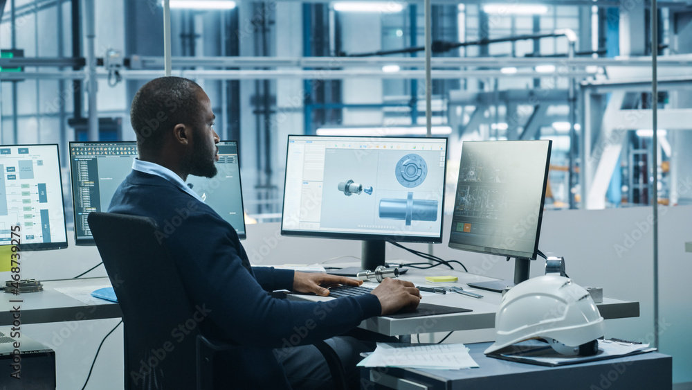 Aufkleber Car Factory Office: Black Engineer Working on Desktop Computer, Screens Show CAD Software with 3D Component, Monitoring of Automated Robot Arm Assembly Line Manufacturing High-Tech Electric Vehicles