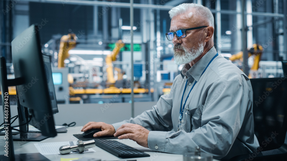 Aufkleber car factory office: portrait of male engineer working on computer. automated robot arm assembly line