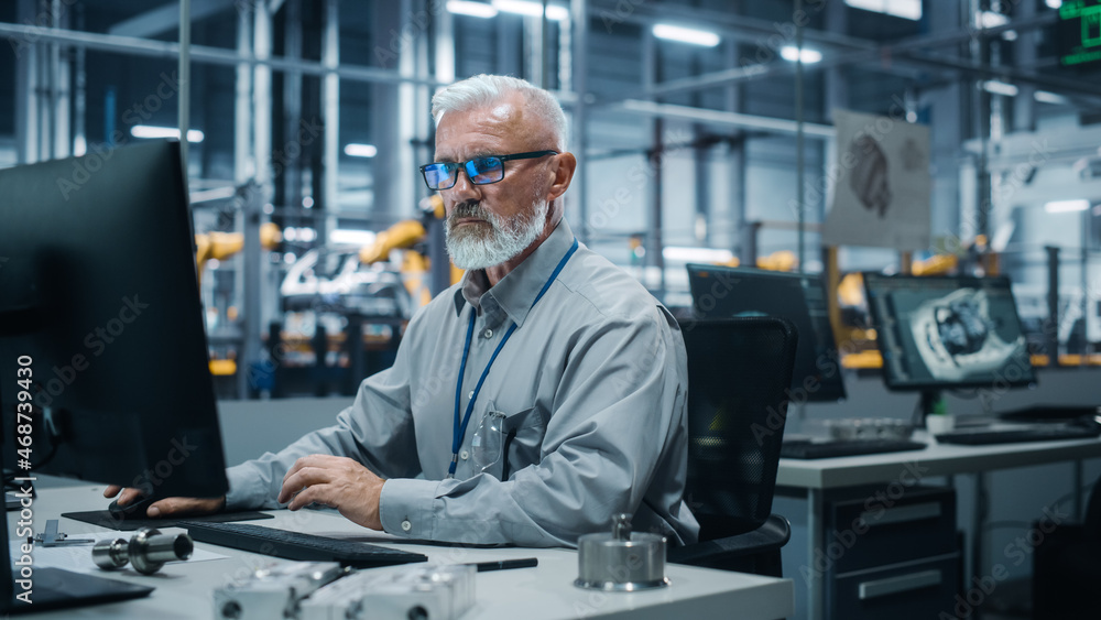 Poster Car Factory Office: Portrait of Male Engineer Working on Computer. Automated Robot Arm Assembly Line Manufacturing Electric Vehicles. Technician Monitoring Electronics Production Conveyor.