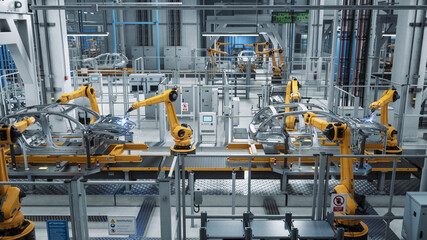 Car Factory 3D Concept: Automated Robot Arm Assembly Line Manufacturing Advanced High-Tech Green Energy Electric Vehicles. Construction, Building, Welding Industrial Production Conveyor.
