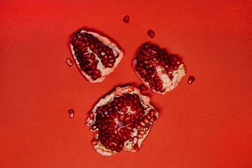 ripe pomegranate on a red background