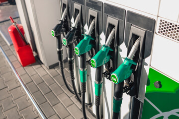 Gasoline and diesel distributor at the gas station. Gas pump nozzles.