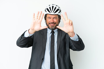 Business senior man with a bike helmet isolated on white background counting eight with fingers