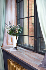 Big wooden window with frame and window sill and nature background