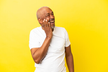Cuban Senior isolated on yellow background with toothache