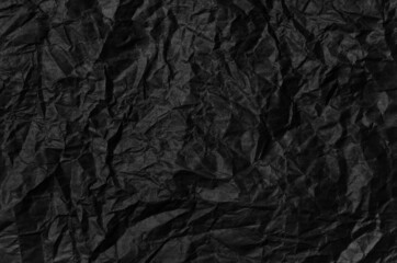 Black crumpled paper texture pattern. Rough grunge old blank.