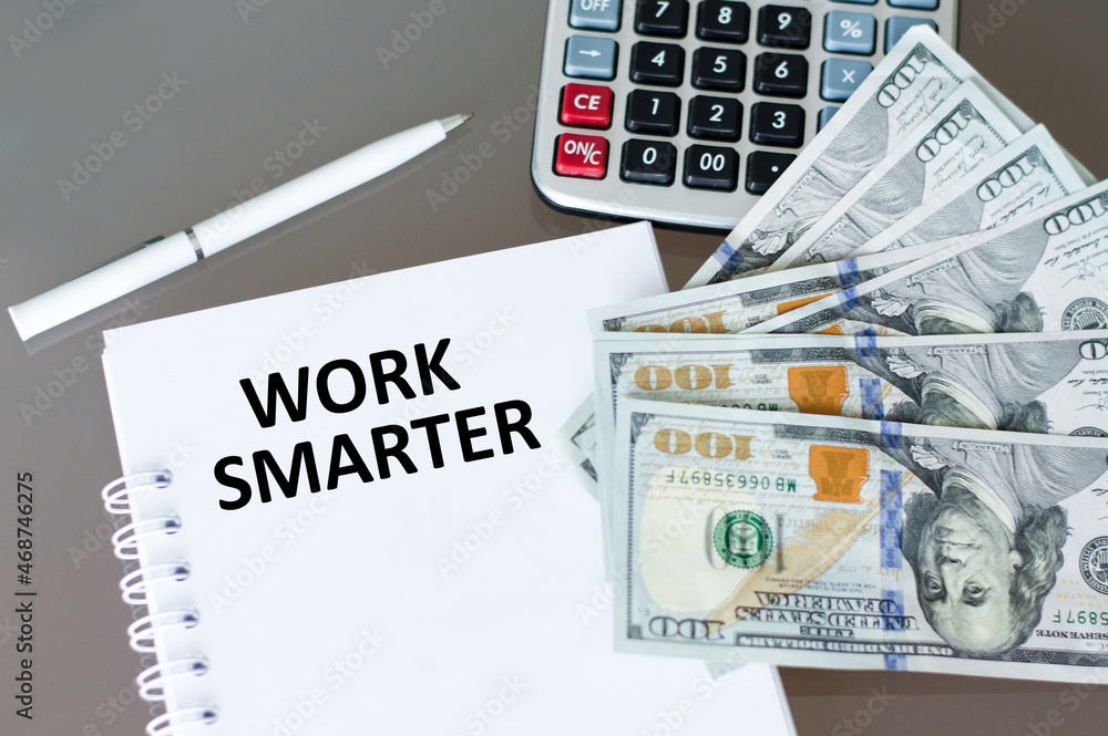 Poster the text work smarter on a notebook on the table next to a calculator and money