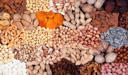 Assortment of nuts and fruits collected in one frame.