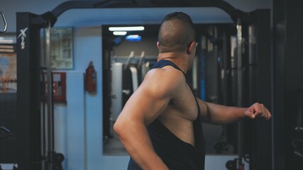 Fototapeta na wymiar Arab man preparing for a big workout in the gym.