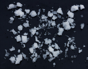 snow chunks lumps texture of snow on a black background