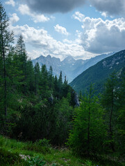 summer mountain tops and peaks under blue cloudy sky in Slovenia national Triglav park