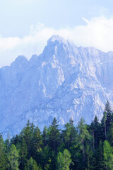 summer mountain tops and peaks under blue cloudy sky in Slovenia national Triglav park