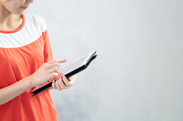 Beautiful Japanese (Asian) woman planning a lesson, Gym instructor Copy space　close-up