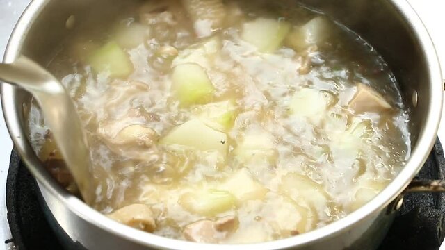 Cooking   winter melon soup with chicken  , in door Chiangmai  Thailand