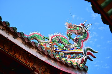 Longshan Temple, Taipei, Taiwan - November 11, 2021: Dragon-shaped Cochin pottery on the eaves of Longshan Temple.