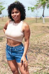 young woman in the park looking at camera.