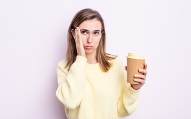 young pretty woman feeling bored, frustrated and sleepy after a tiresome. take away coffee concept