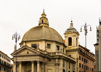 Fototapeta na wymiar Santa Maria in Montesanto church in Piazza del Popolo (People's Square), Rome, Italy