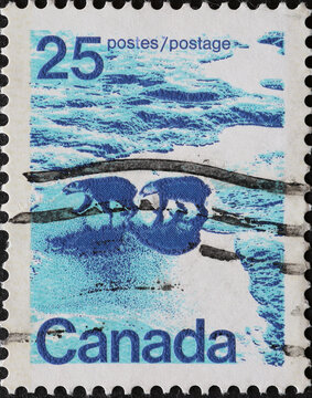 CANADA - CIRCA 1974: A postage stamp from Canada showing a landscape picture with two polar bears (Ursus maritimus)
