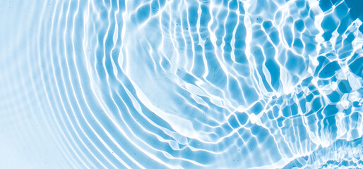 Fototapeta na wymiar Blue water texture, blue mint water surface with rings and ripples 