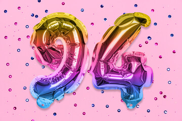 Rainbow foil balloon number, digit ninety four on a pink background with sequins. Birthday greeting...