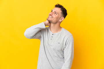 Young caucasian handsome man isolated on yellow background thinking an idea