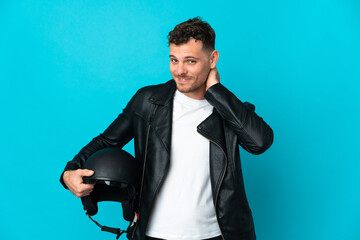 Caucasian man with a motorcycle helmet isolated on blue background laughing