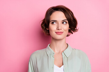 Fototapeta premium Portrait of attractive cheery curious brown-haired girl thinking copy space isolated over pastel pink color background