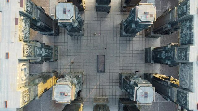 Looking down at the patterned square tiles of The Chronicle of Georgia.