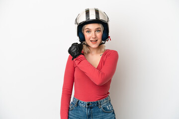 Young caucasian woman with a motorcycle helmet isolated on white background celebrating a victory