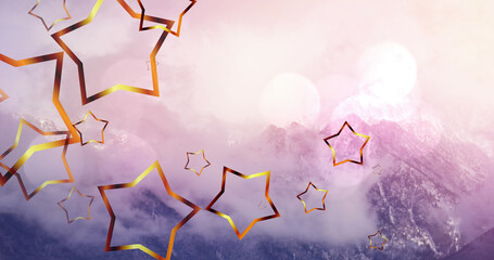 Image of christmas stars falling over mountain landscape in background