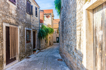 Fototapeta premium Ancient street of Stari Grad, little town in Hvar Island, Croatia