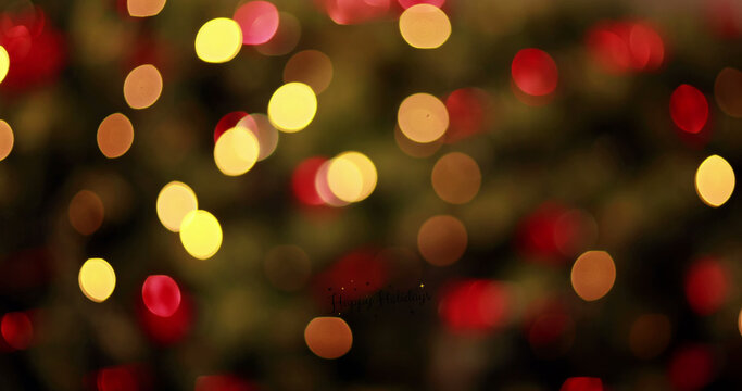 Image of seasons greetings over fairy lights, christmas wreath and decorations