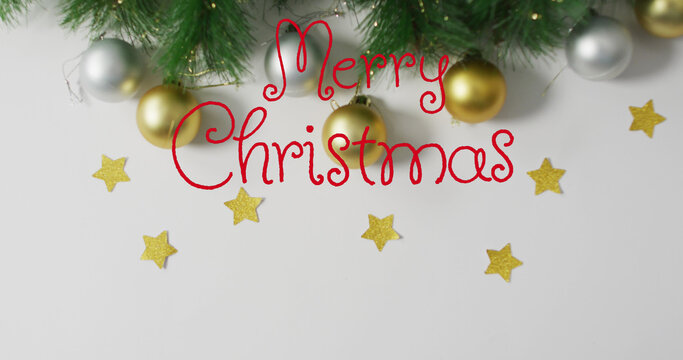 Image of stars falling over merry christmas text on white background