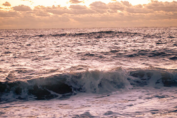 Waves hitting the beach at sunrise in Manasquan, New Jersey 