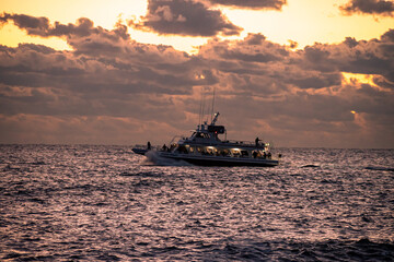 Fishing boats on the ocean at Sunrise