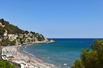 Fototapeten Panoramic view of the coastline with the promontory of Capo Santa Croce in a sunny summer day, Alassio, Savona, Liguria, Italy © Simona Sirio