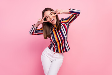 Photo of adorable sweet young woman dressed colorful blouse smiling v-signds cover eyes isolated pink color background