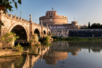 Castel Sant Angelo reflected in the tiber river.