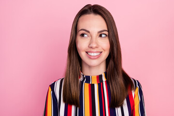 Photo of pretty adorable young lady wear striped shirt smiling looking empty space isolated pink color background