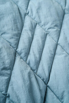 Quilted Fabric Background. Blue  Texture Blanket Or Puffer Jacket