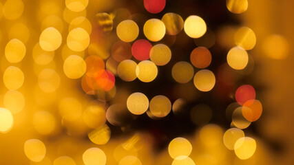 Abstract blurred shot of Christmas lights bokeh blinking and shining. Perfect background for winter holidays