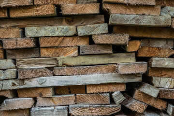 Firewood texture logs rural scene brown background. Pile of wood logs ready for winter. A pile of chopped firewood ready for stacking