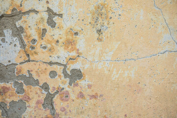 Old rough pink-orange plaster wall surface Artistic. Walls and background, yellow concrete surface