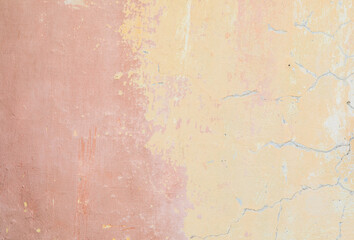 Old rough pink-orange plaster wall surface Artistic. Walls and background, yellow concrete surface