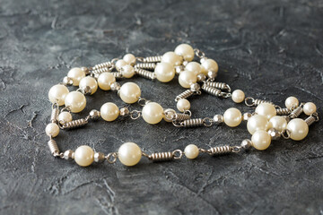  beads necklace on black table
