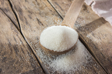 White sugar. Pieces of refined sugar on the fabric. Sugar
